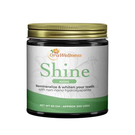 OraWellness Shine mint toothpowder product jar on a white background