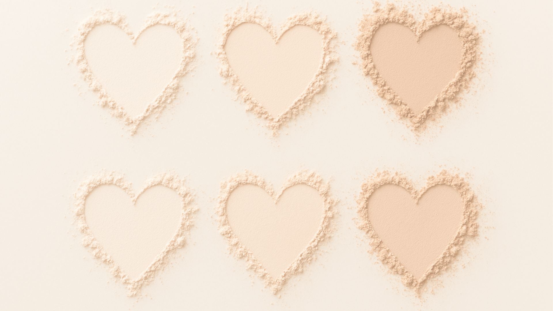 makeup powders arranged in 6 heart shapes on a white background