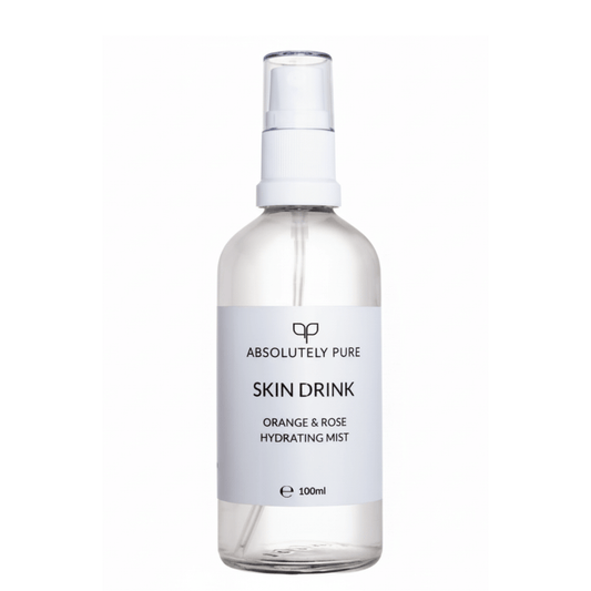Absolutely Pure brand Skin Drink Orange & Rose Hydrating Mist in a clear 100ml bottle with white atomiser and label.